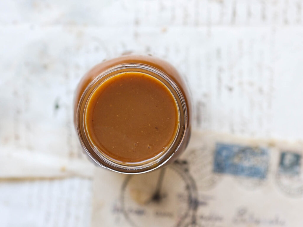 top down shot of jar of vegan pumpkin spice syrup